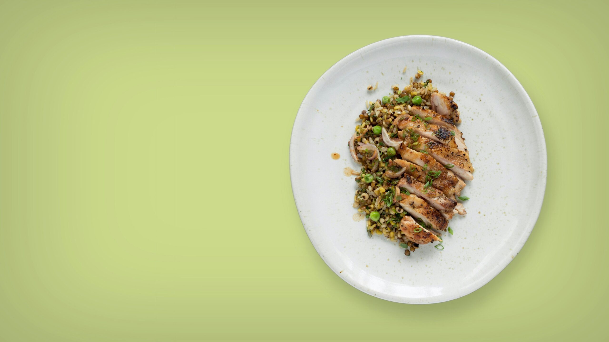 A close-up of organic cat food showing visible chunks of meat and vegetables